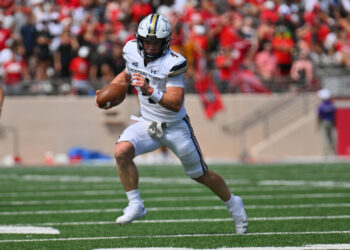 ALBUQUERQUE, NEW MEXICO - AUGUST 24: Quarterback Tommy Mellott #4 of the Montana State Bobcats runs for yardage against the New Mexico Lobos during the first half of their game at University Stadium on August 24, 2024 in Albuquerque, New Mexico. (Photo by Sam Wasson/Getty Images)