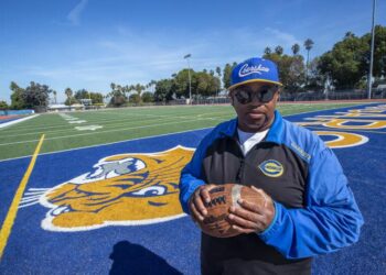 Robert Garrett, head coach of the Crenshaw High School varsity football team, is photographed.