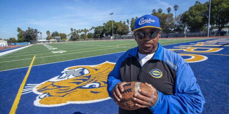 Robert Garrett, head coach of the Crenshaw High School varsity football team, is photographed.