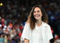 US basketball player Sue Bird opens the session in the women's Gold Medal basketball match between France and the USA during the Paris 2024 Olympic Games at the Bercy  Arena in Paris on August 11, 2024. (Photo by Aris MESSINIS / AFP) (Photo by ARIS MESSINIS/AFP via Getty Images)