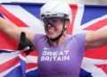 Hannah Cockroft celebrating with the Union flag after winning a gold at the Para Athletics World Championships