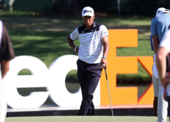 MEMPHIS, TN - AUGUST 17: Hideki Matsuyama (JAP) stands in front of the FedEx sign during the third round of the 2024 FedEx St. Jude Championship on August 17, 2024 at TPC Southwind in Memphis, Tennessee.  (Photo by Michael Wade/Icon Sportswire via Getty Images)