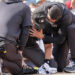 Nick Mahrley was carried off the field on a stretcher after being hit in the head with the barrel of Giancarlo Stanton's bat. (AP Photo/Bryan Woolston)