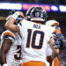 DENVER, COLORADO - AUGUST 18: Bo Nix #10 of the Denver Broncos celebrates with teammates in the first half of the preseason game against the Green Bay Packers at Empower Field At Mile High on August 18, 2024 in Denver, Colorado. (Photo by Tyler Schank/Getty Images)