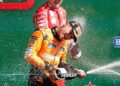 First-placed McLaren's British driver Lando Norris celebrates with third-placed Ferrari's Monegasque driver Charles Leclerc during the podium ceremony after the Formula One Dutch Grand Prix at The Circuit Zandvoort, western Netherlands, on August 25, 2024