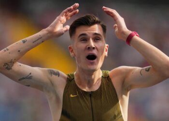 Jakob Ingebrigtsen reacts in shock after breaking the 3,000m world record