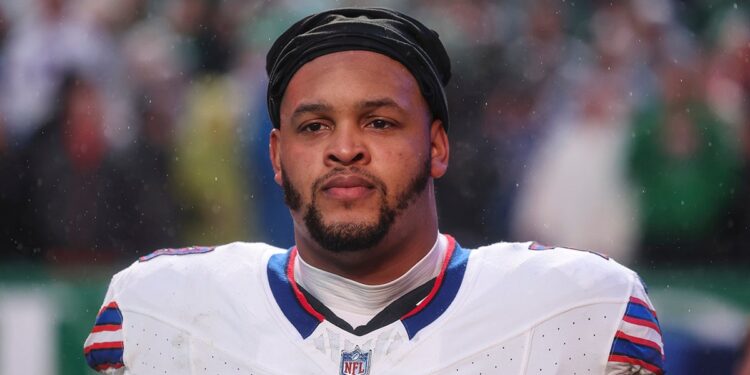 Dion Dawkins looks on before a game