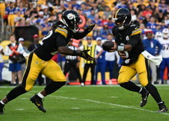 PITTSBURGH, PENNSYLVANIA - AUGUST 17: Russell Wilson #3 of the Pittsburgh Steelers hands the ball off to Najee Harris #22 in the first quarter during the preseason game against the Buffalo Bills at Acrisure Stadium on August 17, 2024 in Pittsburgh, Pennsylvania. (Photo by Justin Berl/Getty Images)