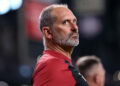 PHOENIX, ARIZONA - JULY 28: Manager Torey Lovullo #17 of the Arizona Diamondbacks looks on during the National Anthem before the game against the Arizona Diamondbacks at Chase Field on July 28, 2024 in Phoenix, Arizona. The Pirates defeated the Diamondbacks 6-5 in 10 innings. (Photo by Chris Coduto/Getty Images)