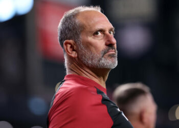 PHOENIX, ARIZONA - JULY 28: Manager Torey Lovullo #17 of the Arizona Diamondbacks looks on during the National Anthem before the game against the Arizona Diamondbacks at Chase Field on July 28, 2024 in Phoenix, Arizona. The Pirates defeated the Diamondbacks 6-5 in 10 innings. (Photo by Chris Coduto/Getty Images)