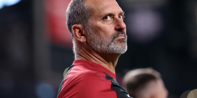 PHOENIX, ARIZONA - JULY 28: Manager Torey Lovullo #17 of the Arizona Diamondbacks looks on during the National Anthem before the game against the Arizona Diamondbacks at Chase Field on July 28, 2024 in Phoenix, Arizona. The Pirates defeated the Diamondbacks 6-5 in 10 innings. (Photo by Chris Coduto/Getty Images)