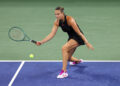 NEW YORK, NEW YORK - AUGUST 26: Aryna Sabalenka of Belarus returns against Priscilla Hon of Australia during their Women's Singles First Round match on Day One of the 2024 US Open at the USTA Billie Jean King National Tennis Center on August 26, 2024 in the Flushing neighborhood of the Queens borough of New York City. (Photo by Jamie Squire/Getty Images)