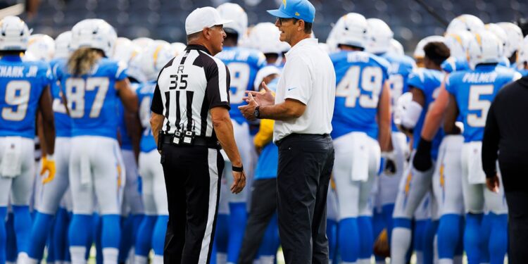 Jim Harbaugh talks with NFL ref