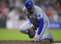 Kansas City Royals first baseman Vinnie Pasquantino reacts after injuring his right hand on a play during the eighth inning of a baseball game against the Houston Astros, Thursday, Aug. 29, 2024, in Houston. (AP Photo/Kevin M. Cox)