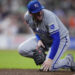 Kansas City Royals first baseman Vinnie Pasquantino reacts after injuring his right hand on a play during the eighth inning of a baseball game against the Houston Astros, Thursday, Aug. 29, 2024, in Houston. (AP Photo/Kevin M. Cox)