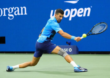 Aug 28, 2024; Flushing, NY, USA;  Novak Djokovic (SRB) hits to Laslo Djere (SRB) on day three of the 2024 U.S. Open tennis tournament at USTA Billie Jean King National Tennis Center. Mandatory Credit: Robert Deutsch-USA TODAY Sports