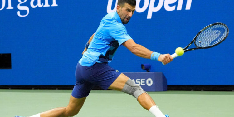 Aug 28, 2024; Flushing, NY, USA;  Novak Djokovic (SRB) hits to Laslo Djere (SRB) on day three of the 2024 U.S. Open tennis tournament at USTA Billie Jean King National Tennis Center. Mandatory Credit: Robert Deutsch-USA TODAY Sports