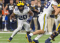 INDIANAPOLIS, INDIANA - DECEMBER 2: Kalel Mullings #20 of the Michigan Wolverines runs the ball against the Iowa Hawkeyes during the Big Ten Championship at Lucas Oil Stadium on December 2, 2023 in Indianapolis, Indiana. (Photo by Michael Hickey/Getty Images)