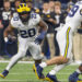 INDIANAPOLIS, INDIANA - DECEMBER 2: Kalel Mullings #20 of the Michigan Wolverines runs the ball against the Iowa Hawkeyes during the Big Ten Championship at Lucas Oil Stadium on December 2, 2023 in Indianapolis, Indiana. (Photo by Michael Hickey/Getty Images)