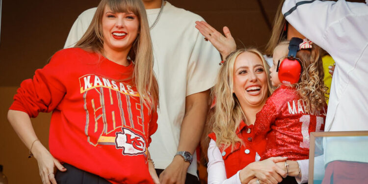 KANSAS CITY, MISSOURI - OCTOBER 22: Taylor Swift and Brittany Mahomes react during a game between the Los Angeles Chargers and Kansas City Chiefs at GEHA Field at Arrowhead Stadium on October 22, 2023 in Kansas City, Missouri. (Photo by David Eulitt/Getty Images)