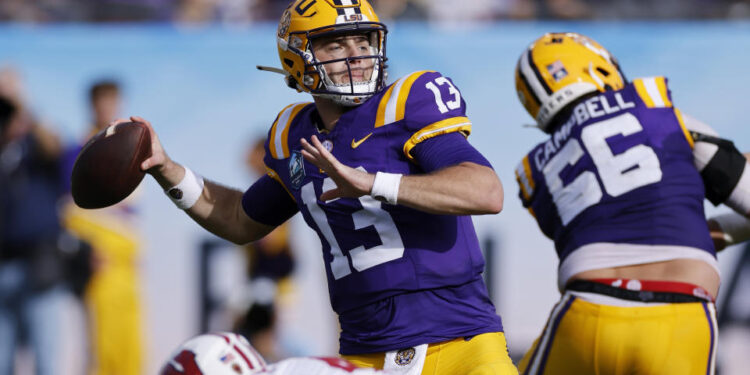 TAMPA, FL - JANUARY 01: LSU Tigers quarterback Garrett Nussmeier (13) passes the ball during the ReliaQuest Bowl against the Wisconsin Badgers on January 1, 2024 at Raymond James Stadium in Tampa, Florida. (Photo by Joe Robbins/Icon Sportswire via Getty Images)