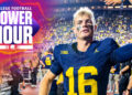 Michigan Wolverines QB Davis Warren high-fives fans after his team's Week 1 win over Fresno State. In Tuesday's AP Poll, the Wolverines are ranked 10th. (Photo by Aaron J. Thornton/Getty Images)
