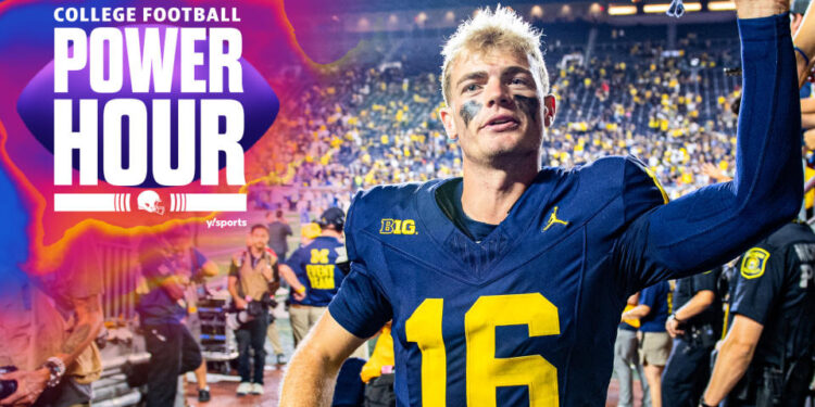 Michigan Wolverines QB Davis Warren high-fives fans after his team's Week 1 win over Fresno State. In Tuesday's AP Poll, the Wolverines are ranked 10th. (Photo by Aaron J. Thornton/Getty Images)
