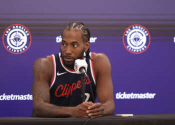 Kawhi Leonard plans to play in the Clippers' season opener. But as usual with his health, it's not a certainty that he will. (Associated Press)