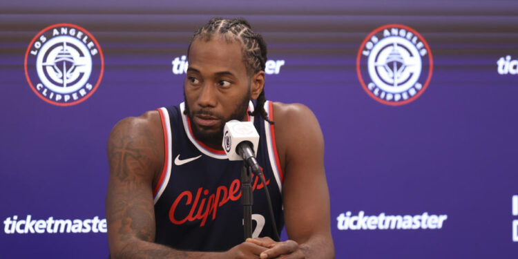 Kawhi Leonard plans to play in the Clippers' season opener. But as usual with his health, it's not a certainty that he will. (Associated Press)