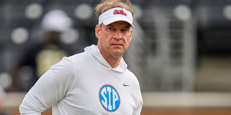 Lane Kiffin watches