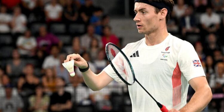 Dan Bethell plays badminton at the Paralympics in Paris