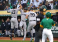 Sep 21, 2024; Oakland, California, USA; New York Yankees designated hitter Giancarlo Stanton (27) is congratulated by right fielder Juan Soto (22) after hitting a three-run home run against the Oakland Athletics in the third inning at the Oakland-Alameda County Coliseum. Mandatory Credit: Cary Edmondson-Imagn Images