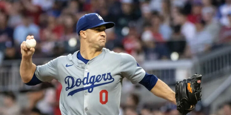 Sep 14, 2024; Cumberland, Georgia, USA; Los Angeles Dodgers pitcher Jack Flaherty (0) pitches the ball against the Atlanta Braves during the first inning at Truist Park. Mandatory Credit: Jordan Godfree-Imagn Images