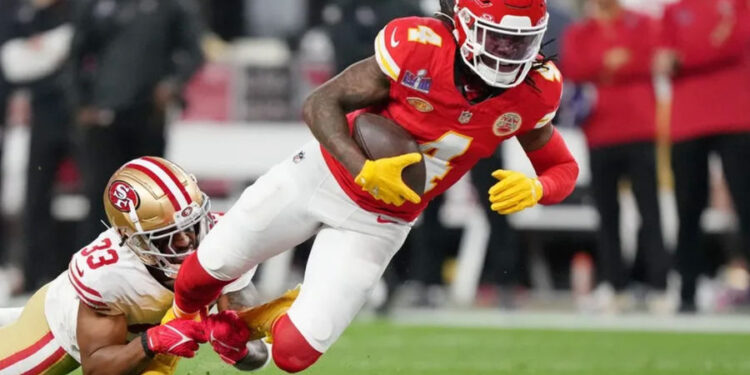 Feb 11, 2024; Paradise, Nevada, USA; San Francisco 49ers safety Logan Ryan (33) tackles Kansas City Chiefs wide receiver Rashee Rice (4) during the second quarter of Super Bowl LVIII at Allegiant Stadium. Mandatory Credit: Kirby Lee-USA TODAY Sports