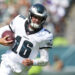 PHILADELPHIA, PENNSYLVANIA - AUGUST 24: Tanner McKee #16 of the Philadelphia Eagles runs the ball against the Minnesota Vikings during the preseason game at Lincoln Financial Field on August 24, 2024 in Philadelphia, Pennsylvania. The Vikings defeated the Eagles 26-3. (Photo by Mitchell Leff/Getty Images)