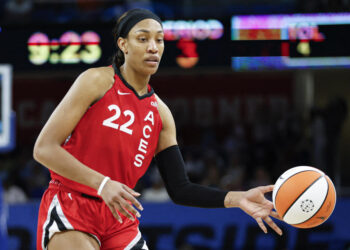 Aug 25, 2024; Chicago, Illinois, USA; Las Vegas Aces center A'ja Wilson (22) passes the ball against the Chicago Sky during the second half at Wintrust Arena. Mandatory Credit: Kamil Krzaczynski-USA TODAY Sports