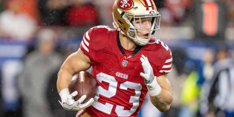 January 20, 2024; Santa Clara, CA, USA; San Francisco 49ers running back Christian McCaffrey (23) runs the ball against the Green Bay Packers during the first quarter in a 2024 NFC divisional round game at Levi's Stadium. Mandatory Credit: Kyle Terada-USA TODAY Sports