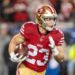 January 20, 2024; Santa Clara, CA, USA; San Francisco 49ers running back Christian McCaffrey (23) runs the ball against the Green Bay Packers during the first quarter in a 2024 NFC divisional round game at Levi's Stadium. Mandatory Credit: Kyle Terada-USA TODAY Sports