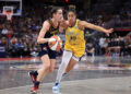 INDIANAPOLIS, INDIANA - MAY 28: Caitlin Clark #22 of the Indiana Fever drives to the basket against Kia Nurse #10 of the Los Angeles Sparks at Gainbridge Fieldhouse on May 28, 2024 in Indianapolis, Indiana. (Photo by Justin Casterline/Getty Images)