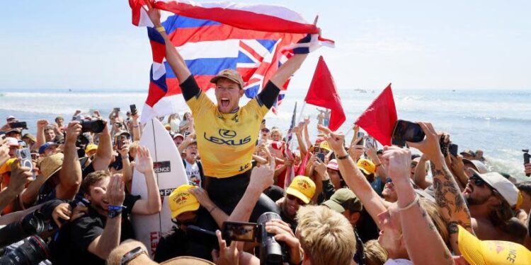 SAN CLEMENTE, CA SEPT. 6, 2024 - Hawaiii's John John Florence is carried off the sand after beating Brazilian Italo Ferreira during the Lexus WSL Finals at Lower Trestles in San Clemente on September 6, 2024. (Allen J. Schaben / Los Angeles Times)