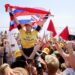 SAN CLEMENTE, CA SEPT. 6, 2024 - Hawaiii's John John Florence is carried off the sand after beating Brazilian Italo Ferreira during the Lexus WSL Finals at Lower Trestles in San Clemente on September 6, 2024. (Allen J. Schaben / Los Angeles Times)