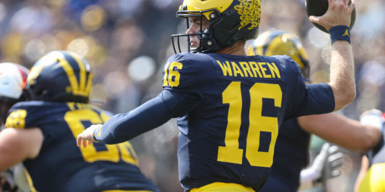 ANN ARBOR, MI - SEPTEMBER 14:  Michigan Wolverines quarterback Davis Warren (16) throws a pass during the first quarter of a non-conference college football game between the Arkansas State Red Wolves and the Michigan Wolverines on September 14, 2024 at Michigan Stadium in Ann Arbor, Michigan.  (Photo by Scott W. Grau/Icon Sportswire via Getty Images)