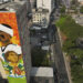 A mural created by artist Crica featuring Philadelphia Eagles quarterback Jalen Hurts and Green Bay Packers quarterback Jordan Love adorns an apartment building in downtown Sao Paulo. (AP Photo/Andre Penner)