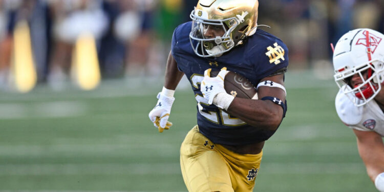 SOUTH BEND, IN - SEPTEMBER 21: Notre Dame Fighting Irish RB Devyn Ford (22) runs with the ball during a college football game between the Notre Dame Fighting Irish and Miami RedHawks on September 21, 2024 at Notre Dame Stadium in South Bend, IN (Photo by James Black/Icon Sportswire via Getty Images)