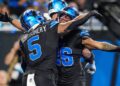 Jahmyr Gibbs celebrates touchdown