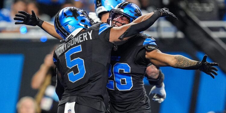 Jahmyr Gibbs celebrates touchdown