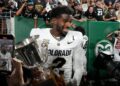 Shedeur Sanders holds trophy