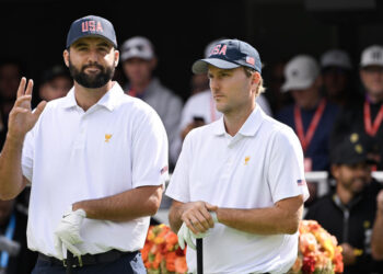 MONTREAL, QUEBEC - SEPTEMBER 26: Scottie Scheffler of the U.S. Team and Russell Henley of the U.S. Team stand on the first tee during Four-Ball on day one of the 2024 Presidents Cup at The Royal Montreal Golf Club on September 26, 2024 in Montreal, Quebec. (Photo by Ben Jared/PGA TOUR via Getty Images)