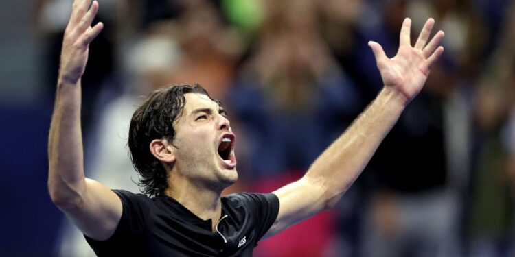 Taylor Fritz celebrates victory over Frances Tiafoe in the US Open