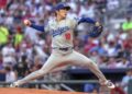 Los Angeles Dodgers pitcher Yoshinobu Yamamoto throws in the first inning of a baseball game.